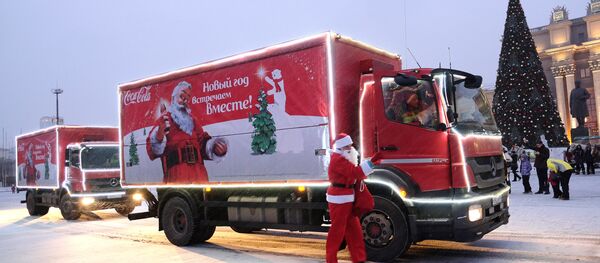 The caravan of Coca-Cola Christmas trucks on the square in front of the Oktyabrsky district administration in Samara The caravan of Coca-Cola Christmas trucks on the square in front of the Oktyabrsky district administration in Samara - Sputnik International