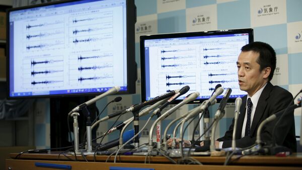 Japan Meteorological Agency's earthquake and tsunami observations division director Yohei Hasegawa speaks next to graphs of ground motion waveform data observed in Japan during a news conference at the Japan Meteorological Agency in Tokyo on implications that an earthquake sourced around North Korea was triggered by an unnatural reason January 6, 2016 - Sputnik International