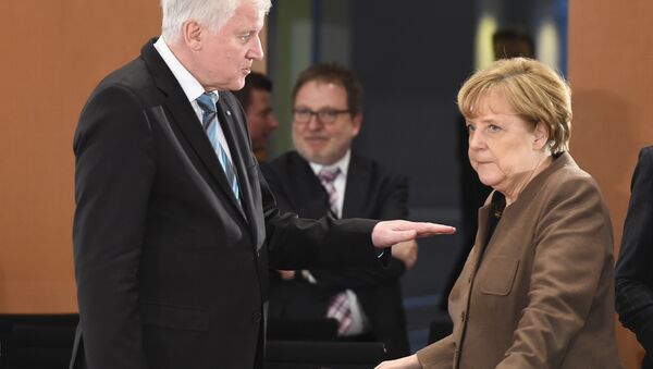Seehofer and Merkel - Sputnik International