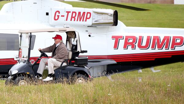 Donald Trump pilots some Trump vehicles around Trump Turnberry. - Sputnik International