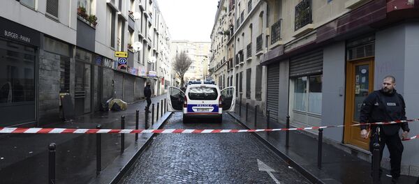 French police are seen behind a police cordon at the Rue des Islettes near Barbes-Rochechouart metro station in the north of Paris on January 7, 2016, after police shot a man dead as he was trying to enter a police station French police are seen behind a police cordon at the Rue des Islettes near Barbes-Rochechouart metro station in the north of Paris on January 7, 2016, after police shot a man dead as he was trying to enter a police station - Sputnik International