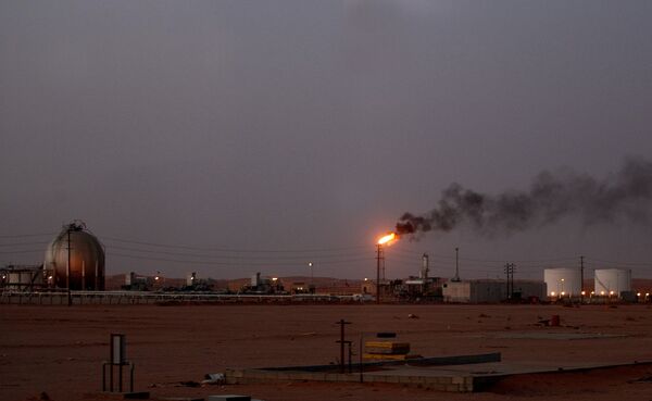 A flame from a Saudi Aramco (the national oil company) oil installation known as Pump 3 burns brightly during sunset in the Saudi Arabian desert near the oil-rich area Al-Khurais, 160 kms east of the capital Riyadh A flame from a Saudi Aramco (the national oil company) oil installation known as Pump 3 burns brightly during sunset in the Saudi Arabian desert near the oil-rich area Al-Khurais, 160 kms east of the capital Riyadh - Sputnik International