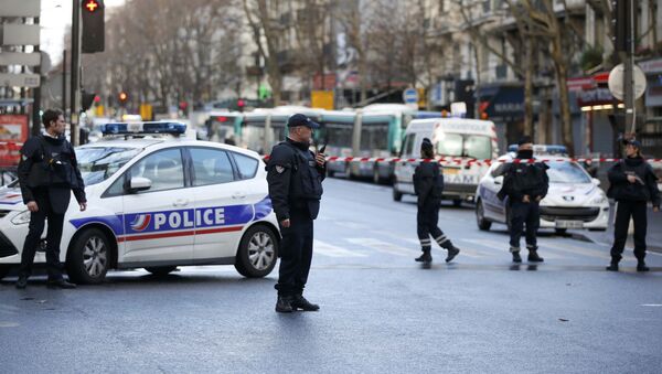 French police secure the area after a man was shot dead at a police station in the 18th district in Paris, France January 7, 2016 - Sputnik International