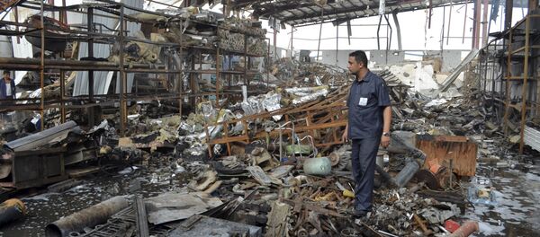 A worker stands at a beverages factory after it was hit by a Saudi-led air strike in Yemen's Red Sea port city of Houdieda January 6, 2016. A worker stands at a beverages factory after it was hit by a Saudi-led air strike in Yemen's Red Sea port city of Houdieda January 6, 2016. - Sputnik International