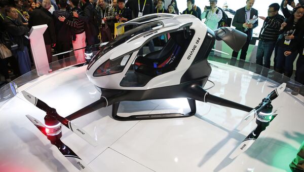 The EHang 184 autonomous aerial vehicle is unveiled at the EHang booth at CES International, Wednesday, Jan. 6, 2016, in Las Vegas. - Sputnik International