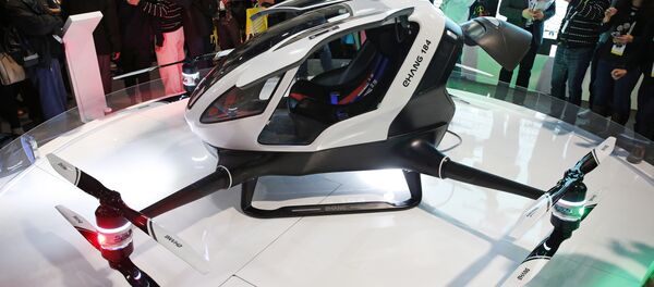 The EHang 184 autonomous aerial vehicle is unveiled at the EHang booth at CES International, Wednesday, Jan. 6, 2016, in Las Vegas. - Sputnik International