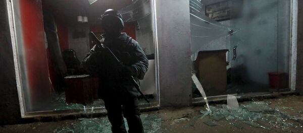 An Afghan policeman stands guard at the site of an explosion in Kabul, Afghanistan, in this January 4, 2016 file photo. - Sputnik International