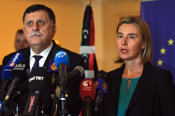 Libyan Prime Minister Fayez al-Sarraj (L) and EU foreign policy chief Federica Mogherini (R) attend a joint press conference in Tunis on January 8, 2016. Libyan Prime Minister Fayez al-Sarraj (L) and EU foreign policy chief Federica Mogherini (R) attend a joint press conference in Tunis on January 8, 2016. - Sputnik International