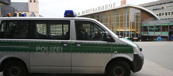 A police vehicle patrols at the main square and in front of the central railway station in Cologne, Germany, January 5, 2016 - Sputnik International