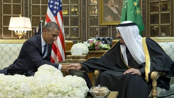 President Barack Obama and new Saudi Arabian King, Salman bin Abdul Aziz, are photographed as they shake hands in a bilateral meeting at Erga Palace in Riyadh, Saudi Arabia, Tuesday, Jan. 27, 2015 - Sputnik International