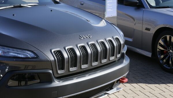 A Jeep Cherokee Trailhawk is displayed with Chrysler and Fiat vehicles at Chrysler Group LLC world headquarters in Auburn Hills, Mich., Tuesday, May 6, 2014 - Sputnik International