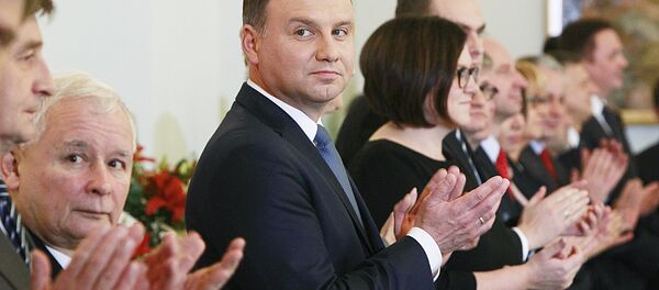 Polish President Andrzej Duda,center, and the leader of Law and Justice party Jaroslaw Kaczynski, second left, attend the Prime Minister nomination ceremony for Beata Szydlo in the Presidential Palace in Warsaw, Poland, Friday, Nov. 13, 2015 Polish President Andrzej Duda,center, and the leader of Law and Justice party Jaroslaw Kaczynski, second left, attend the Prime Minister nomination ceremony for Beata Szydlo in the Presidential Palace in Warsaw, Poland, Friday, Nov. 13, 2015 - Sputnik International