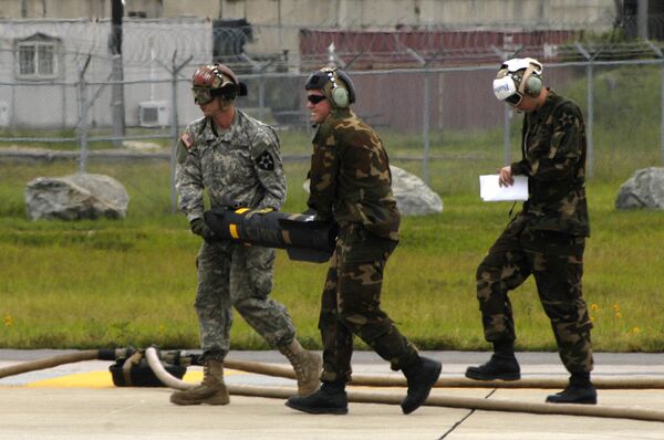 US Army soldiers load Hellfire missiles. US Army soldiers load Hellfire missiles. - Sputnik International