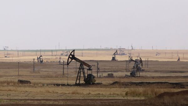 Oil well pumps are seen in the Rmeilane oil field in Syria's northerneastern Hasakeh province - Sputnik International
