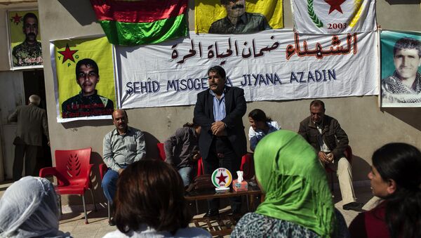 Salih Muslim, head of the Democratic Union Party (PYD) receives condolences from Kurdish people after his son Servan was killed allegedly by a Jabhat al-Nusra sniper several days ago on October 15, 2013. - Sputnik International