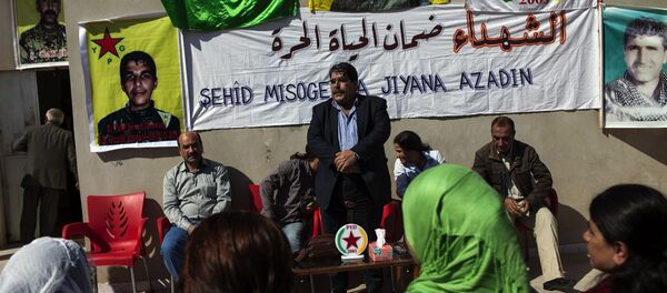 Salih Muslim, head of the Democratic Union Party (PYD) receives condolences from Kurdish people after his son Servan was killed allegedly by a Jabhat al-Nusra sniper several days ago on October 15, 2013. - Sputnik International