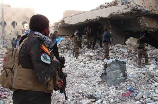 Iraqi forces secure an area in Ramadi, the capital of Iraq's Anbar province, on January 10, 2016, after retaking the city from Islamic State (IS) group jihadists - Sputnik International