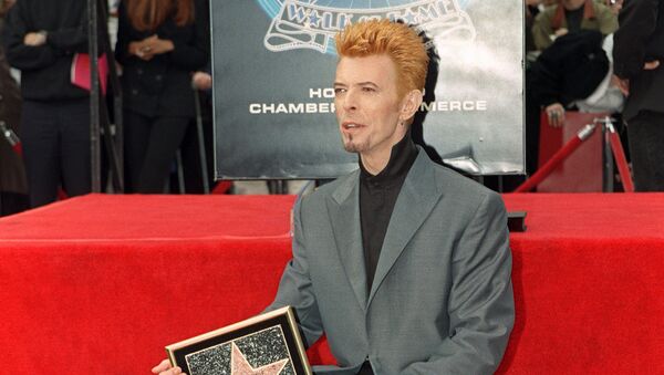 British singer David Bowie poses for photos after he received a star on the world famous Walk of Fame, 12 February 1997, in Hollywood, CA. - Sputnik International