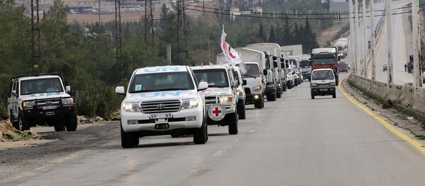 Aid convoys carrying food, medicine and blankets, leave the Syrian capital Damascus as they head to the besieged town of Madaya on January 11, 2015 Aid convoys carrying food, medicine and blankets, leave the Syrian capital Damascus as they head to the besieged town of Madaya on January 11, 2015 - Sputnik International
