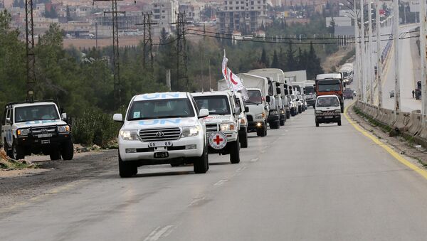 Aid convoys carrying food, medicine and blankets, leave the Syrian capital Damascus as they head to the besieged town of Madaya on January 11, 2015 - Sputnik International