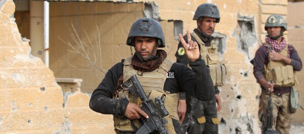 Members of Iraq's elite counter-terrorism service stand on December 27, 2015 in the Hoz neighbourhood in central Ramadi, the capital of Iraq's Anbar province, about 110 kilometers west of Baghdad, during military operations conducted by Iraqi pro-government forces against the Islamic State (IS) jihadist group Members of Iraq's elite counter-terrorism service stand on December 27, 2015 in the Hoz neighbourhood in central Ramadi, the capital of Iraq's Anbar province, about 110 kilometers west of Baghdad, during military operations conducted by Iraqi pro-government forces against the Islamic State (IS) jihadist group - Sputnik International