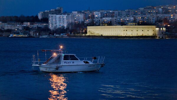 A pleasure boat with Sevastopol in the background - Sputnik International