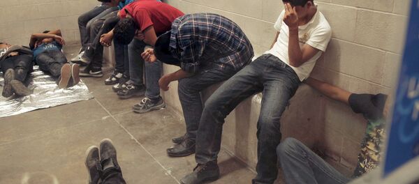 Immigrants who have been caught crossing the border illegally are housed inside the Border Patrol Station in McAllen. Immigrants who have been caught crossing the border illegally are housed inside the Border Patrol Station in McAllen. - Sputnik International