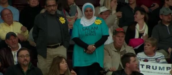 WATCH: Muslim Woman Chased Out of Trump Campaign Event by Angry Crowd WATCH: Muslim Woman Chased Out of Trump Campaign Event by Angry Crowd - Sputnik International