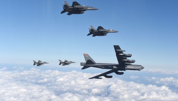 This picture taken by the Republic of Korea Air Force on January 10, 2016 and released via Yonhap news agency shows a US B-52 Stratofortress (bottom R) flying with South Korean F-15K fighter jets (top) and US F-16 fighter jets (bottom L) over South Korea - Sputnik International