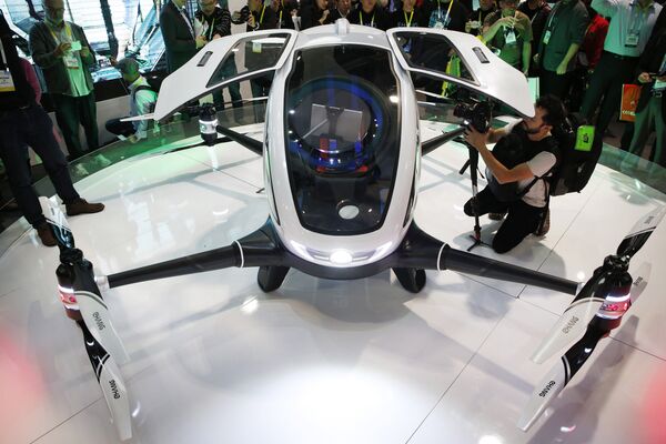 The EHang 184 autonomous aerial vehicle is unveiled at the EHang booth at CES International, Wednesday, Jan. 6, 2016, in Las Vegas The EHang 184 autonomous aerial vehicle is unveiled at the EHang booth at CES International, Wednesday, Jan. 6, 2016, in Las Vegas - Sputnik International