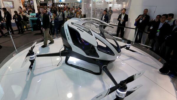 The newly-launched EHang 184 AAV (Autonomous Aerial Vehicle) that can autonomously fly a human passenger, programmed with an app, is displayed at the CES 2016 Consumer Electronics Show in Las Vegas, Nevada on January 7, 2016 - Sputnik International
