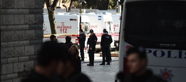 Turkish police stand next to ambulances as they block access to the Blue Mosque area on January 12, 2016 after a blast in Istanbul's tourist hub of Sultanahmet left 10 people dead - Sputnik International