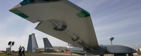 In this March 7, 2007, file photo, Israeli Air Force officers stand next to an Israeli army Heron TP drone, also known locally as the Eitan, during a display at the Palmahim Air Force Base In this March 7, 2007, file photo, Israeli Air Force officers stand next to an Israeli army Heron TP drone, also known locally as the Eitan, during a display at the Palmahim Air Force Base - Sputnik International