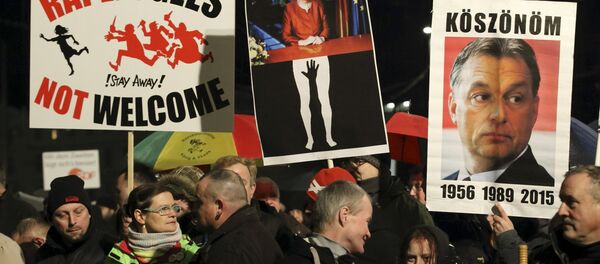 Members of LEGIDA, the Leipzig arm of the anti-Islam movement Patriotic Europeans Against the Islamisation of the West (PEGIDA), take part in a rally in Leipzig, Germany January 11, 2016. Members of LEGIDA, the Leipzig arm of the anti-Islam movement Patriotic Europeans Against the Islamisation of the West (PEGIDA), take part in a rally in Leipzig, Germany January 11, 2016. - Sputnik International