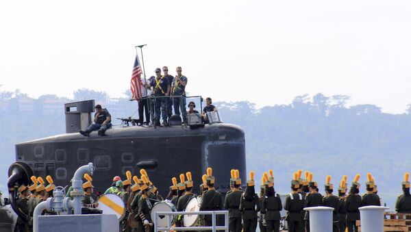 A local marching band welcomes the arrival of sailors aboard the USS Topeka (SSN-754), a Los Angeles-class submarine, as it prepares to be docked at the Alava pier off Subic port in Zambales province for a three-day port call at northwestern Philippines, Tuesday, Jan. 12, 2016 - Sputnik International