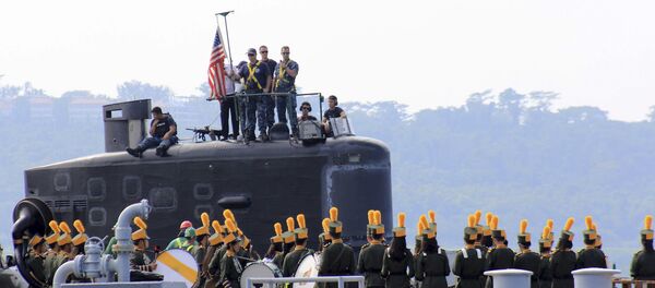 A local marching band welcomes the arrival of sailors aboard the USS Topeka (SSN-754), a Los Angeles-class submarine, as it prepares to be docked at the Alava pier off Subic port in Zambales province for a three-day port call at northwestern Philippines, Tuesday, Jan. 12, 2016 - Sputnik International