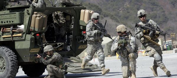 U.S. Army soldiers from the 25th Infantry Division’s 2nd Stryker Brigade Combat Team and South Korean soldiers take their position during a demonstration of the combined arms live-fire exercise. - Sputnik International
