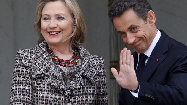 Then Secretary of State Hillary Clinton, left, is welcomed by then French President Nicolas Sarkozy before a crisis summit on Libya at the Elysee palace in Paris, Saturday, March, 19, 2011. - Sputnik International