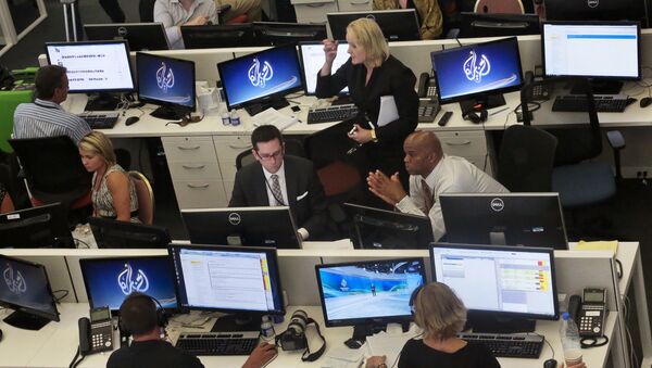 Al-Jazeera America editorial newsroom staff prepare for their first broadcast in New York. - Sputnik International