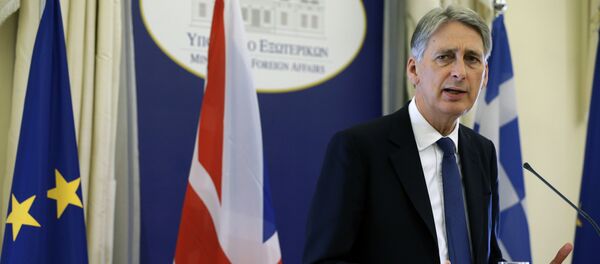 British Foreign Secretary Philip Hammond answers to a question during a news conference. British Foreign Secretary Philip Hammond answers to a question during a news conference. - Sputnik International