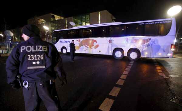 Police escort a bus carrying refugees from the Bavarian town of Landshut after it left the Chancellery building in Berlin, Germany, January 14, 2016 Police escort a bus carrying refugees from the Bavarian town of Landshut after it left the Chancellery building in Berlin, Germany, January 14, 2016 - Sputnik International