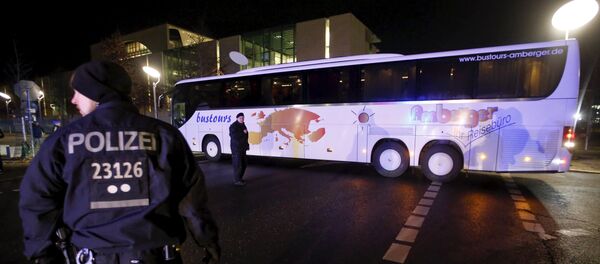 Police escort a bus carrying refugees from the Bavarian town of Landshut after it left the Chancellery building in Berlin, Germany, January 14, 2016 Police escort a bus carrying refugees from the Bavarian town of Landshut after it left the Chancellery building in Berlin, Germany, January 14, 2016 - Sputnik International