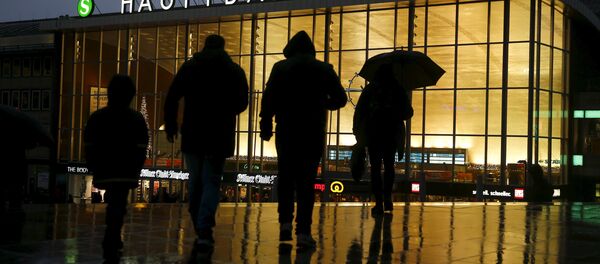 People walk in front of the main railways station in Cologne. People walk in front of the main railways station in Cologne. - Sputnik International