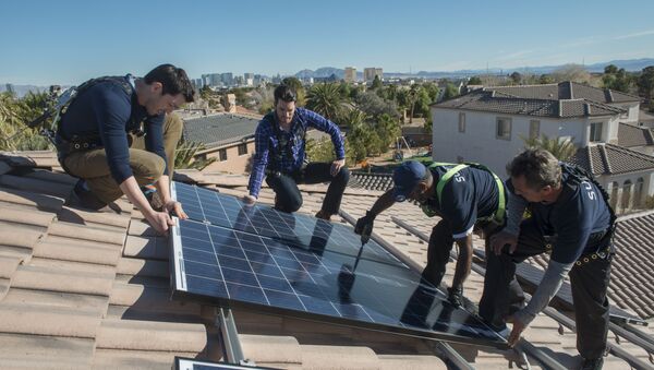 In this handout photograph provided by Sunrun, real estate experts install solar panels on a home in Las Vegas. - Sputnik International