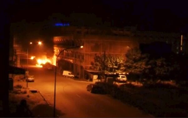 A general view shows fire beneath Splendid Hotel in Ouagadougou - Sputnik International