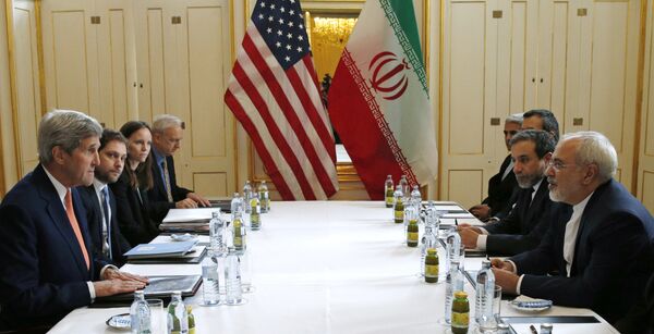 US Secretary of State John Kerry, left, meets with Iranian Foreign Minister Mohammad Javad Zarif, right, in Vienna, Austria, Saturday, Jan. 16, 2016, on what is expected to be implementation day, the day the International Atomic Energy Agency (IAEA) verifies that Iran has met all conditions under the nuclear deal. US Secretary of State John Kerry, left, meets with Iranian Foreign Minister Mohammad Javad Zarif, right, in Vienna, Austria, Saturday, Jan. 16, 2016, on what is expected to be implementation day, the day the International Atomic Energy Agency (IAEA) verifies that Iran has met all conditions under the nuclear deal. - Sputnik International