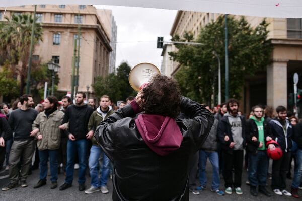 A demonstrator shouts slogans in a megaphone during a rally in central Athens on January 16, 2016 called by Greek main workers' unions to condemn a planned overhaul of Greece's pension system demanded by its international creditors. A demonstrator shouts slogans in a megaphone during a rally in central Athens on January 16, 2016 called by Greek main workers' unions to condemn a planned overhaul of Greece's pension system demanded by its international creditors. - Sputnik International