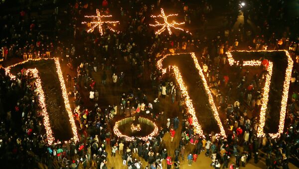 This overhead photo shows candles indicating Future 1.17 during a memorial service to mark the 21st anniversary of the Great Hanshin Earthquake at a park in Kobe, Hyogo prefecture, western Japan on January 17, 2016 - Sputnik International