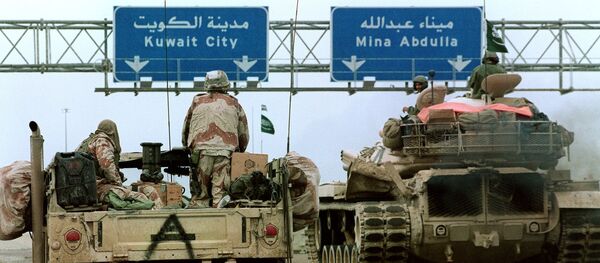 A US Hummvee jeep (l) and a Saudi tank pass under a highway sign directing them to Kuwait City 26 February 1991 during Desert Storm Allied forces offensive A US Hummvee jeep (l) and a Saudi tank pass under a highway sign directing them to Kuwait City 26 February 1991 during Desert Storm Allied forces offensive - Sputnik International