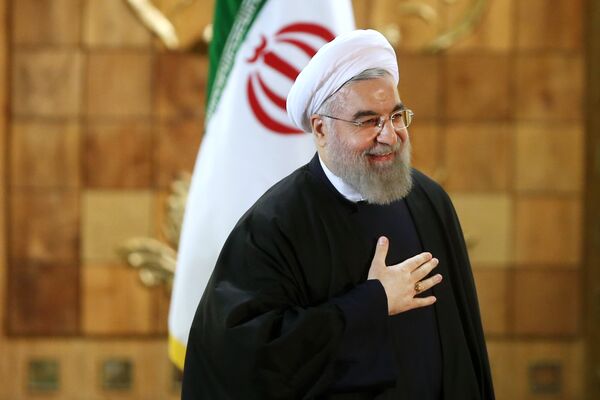 Iran's President Hassan Rouhani gestures at the conclusion of his press conference, in Tehran, Iran, Sunday, Jan. 17, 2016. Iran's President Hassan Rouhani gestures at the conclusion of his press conference, in Tehran, Iran, Sunday, Jan. 17, 2016. - Sputnik International